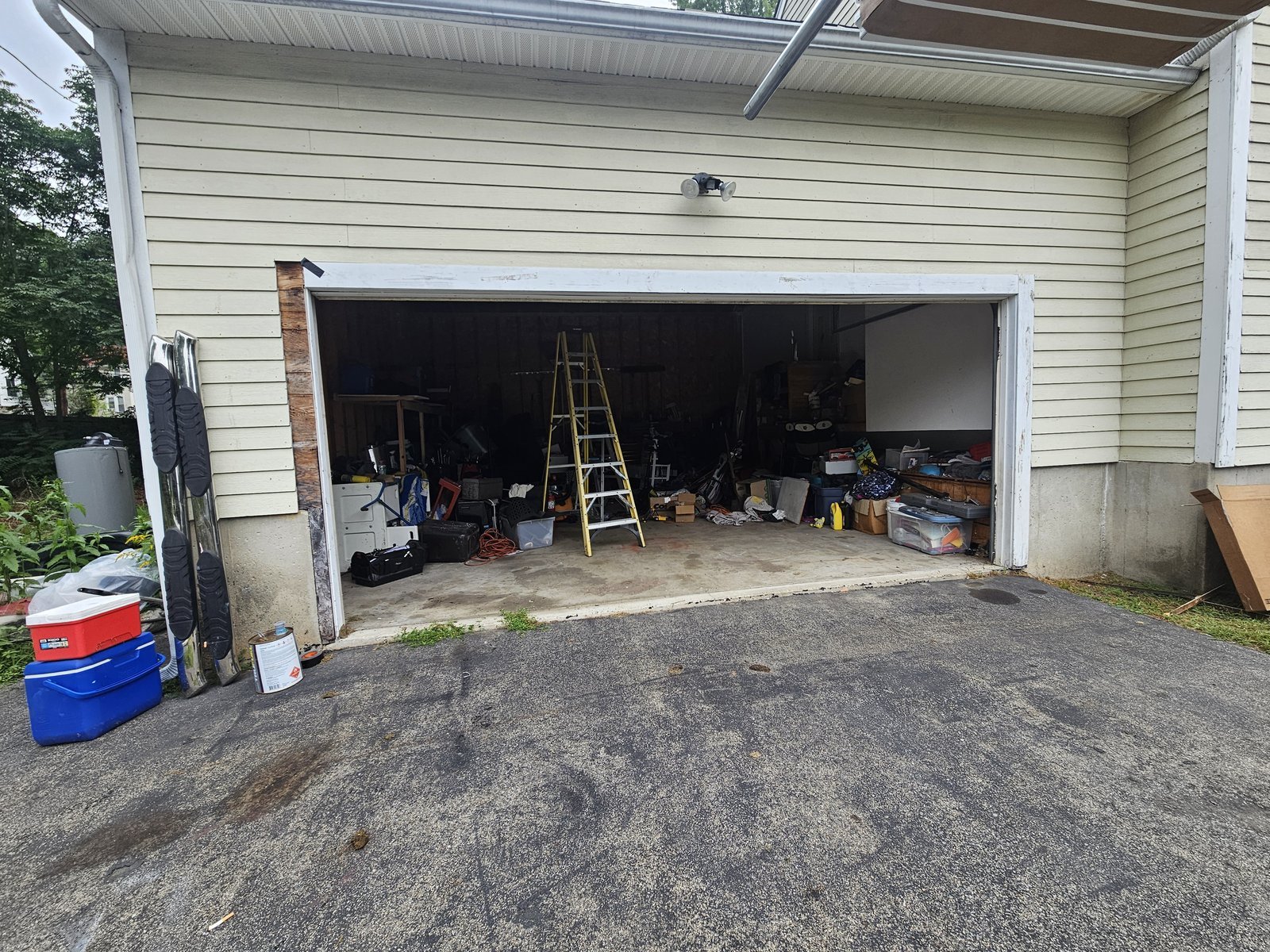 Garage door opening before replacement, door removed ahead of new installation
