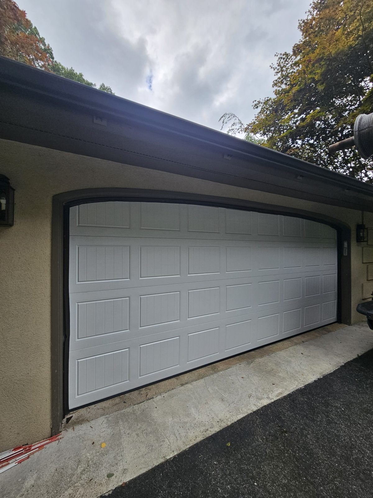 New white double garage door installed in Framingham, MA