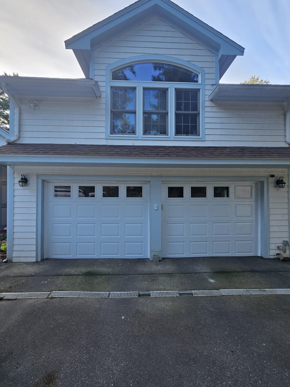 New white garage doors with windows installed in Belmont, MA