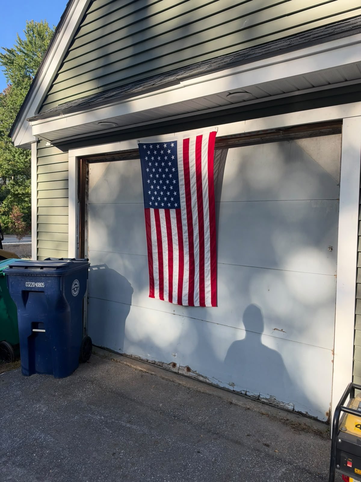 Old garage door before replacement in Billerica, MA