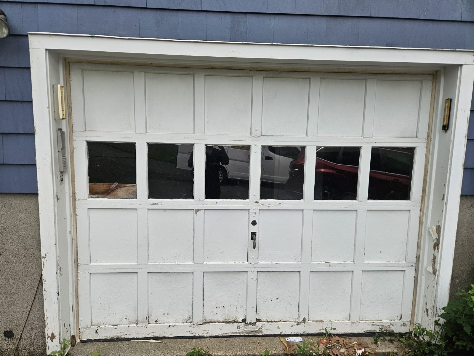 Garage door before replacement, door removed ahead of new installation