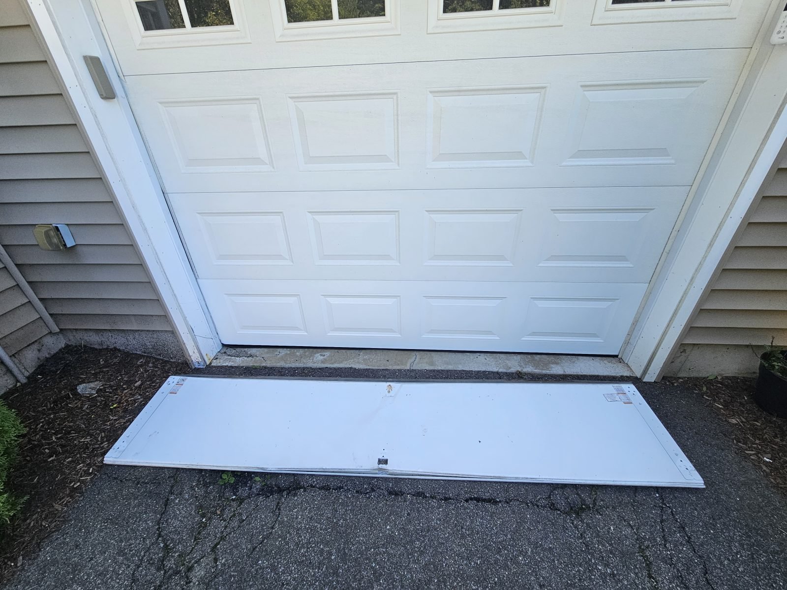 Garage door panel replacement photo