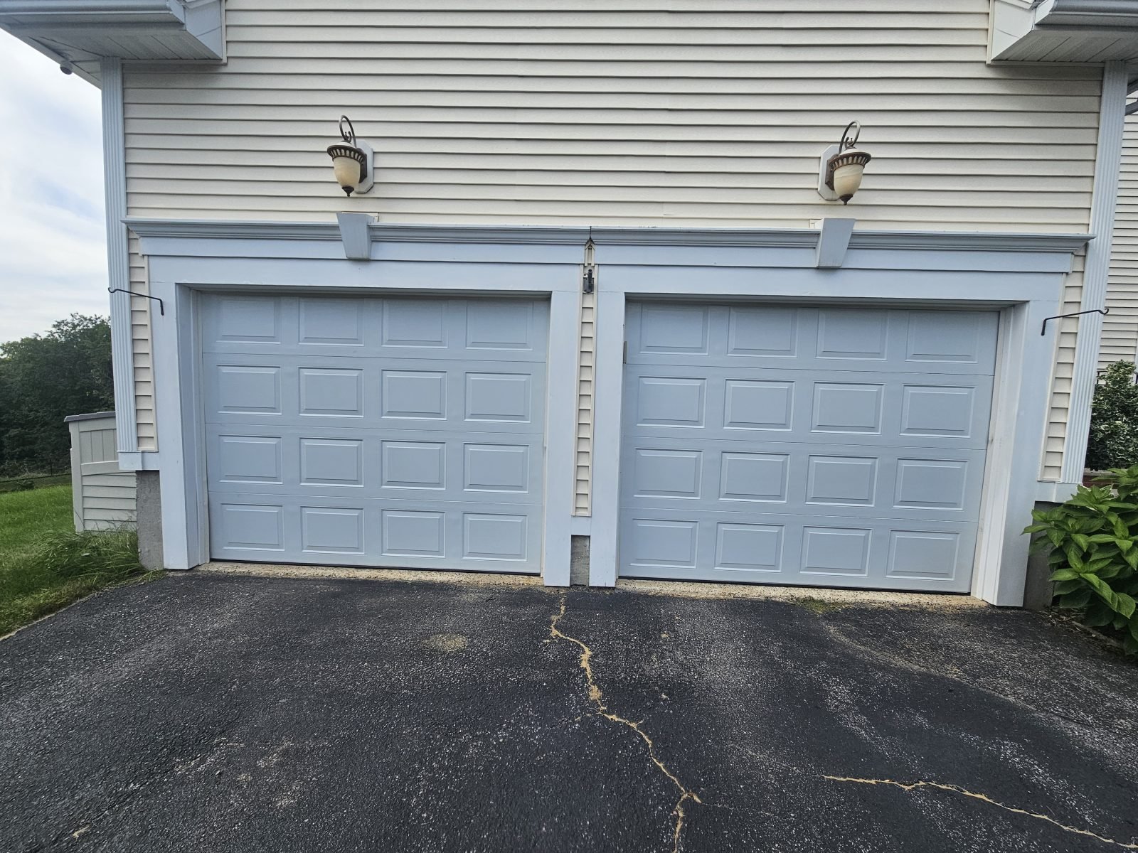 New white raised-panel garage door installed